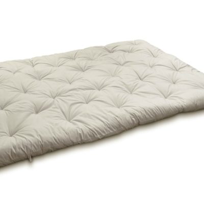 Outstretched wool-filled and tufted mattress topper.