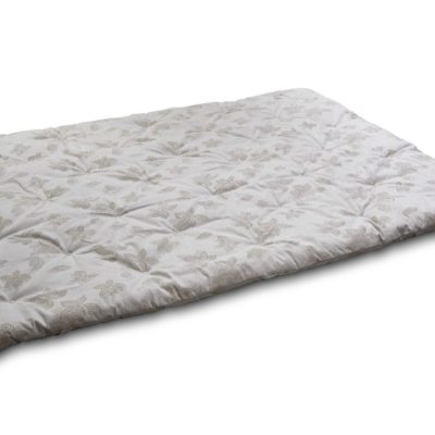 Outstretched wool-filled mattress pad with a tufted, neutrally colored floral print.